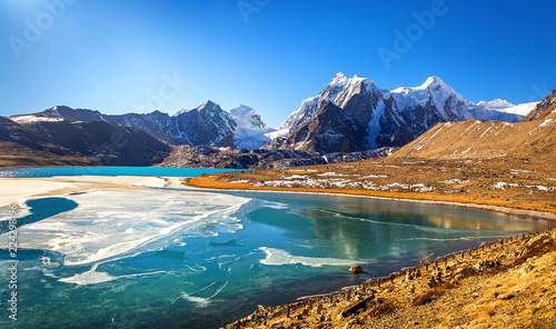 Himalayan Gurudongmar lake at North Sikkim India located at an altitude of 17840 feet. photo