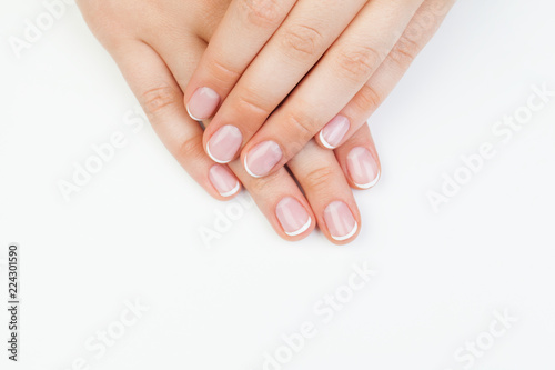 Beautiful female hands. Manicured hands on white background