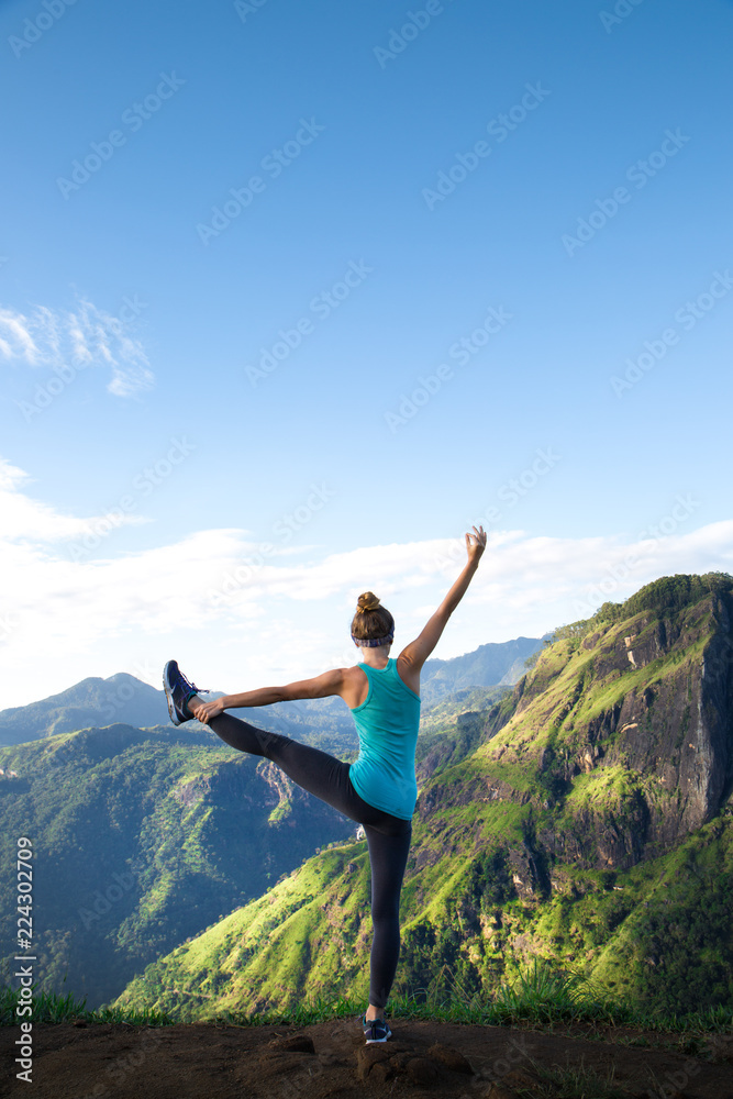 Girl doing yoga in the mountains Girl doing yoga in the mountains