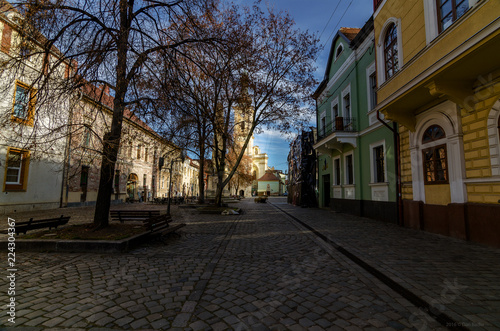 City street in autumn season. City travel, space for text, old church, architecture