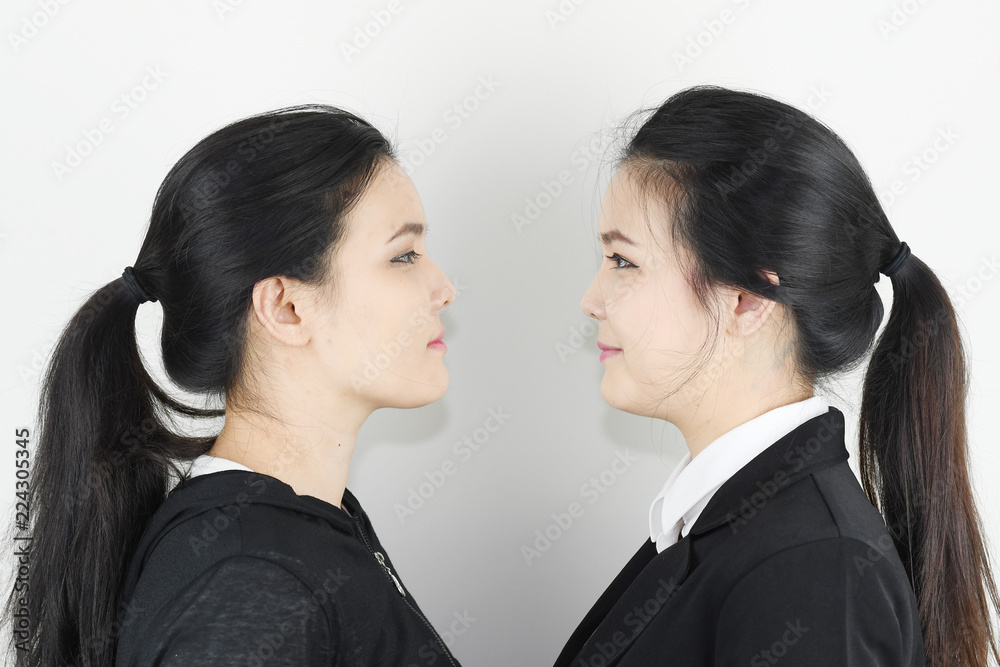 Twin sister young asian portrait with emotions on white background. Twin sister young asian portrait with emotions on white background.