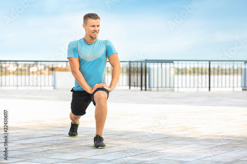 Sporty young man training outdoors