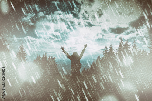 Girl praying for good weather on a rainy day.