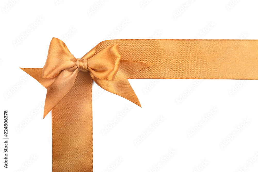 Fototapeta premium Golden ribbons with beautiful bow on white background