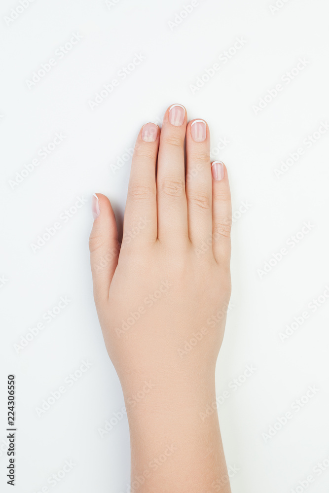Manicure concept. Beautiful female hand on white background Manicure concept. Beautiful female hand on white background