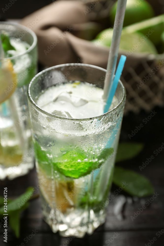 Glass of fresh mojito on wooden table Glass of fresh mojito on wooden table