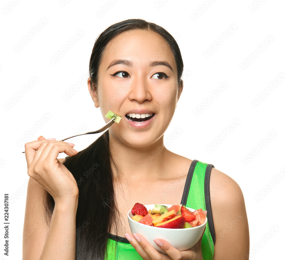 Asian woman with healthy fruit salad on white background Asian woman with healthy fruit salad on white background