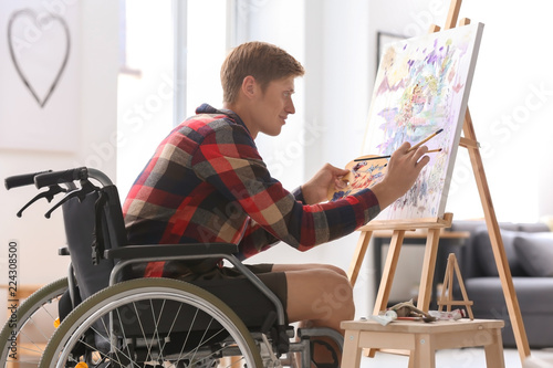 Young artist in wheelchair ...