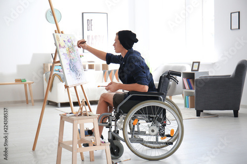 Young artist in wheelchair ...