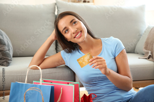 Happy young woman with shop...