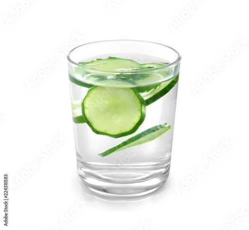 Glass of fresh cucumber water on white background