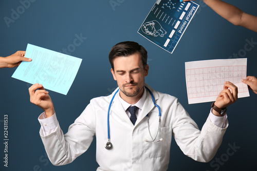 Handsome calm doctor on col...