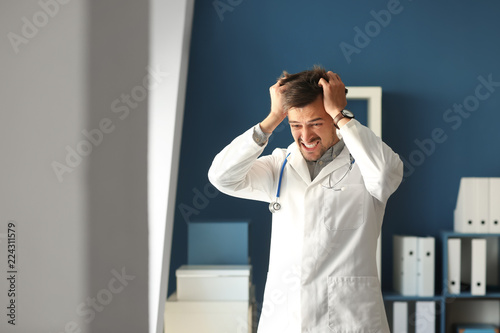 Stressed doctor in his office