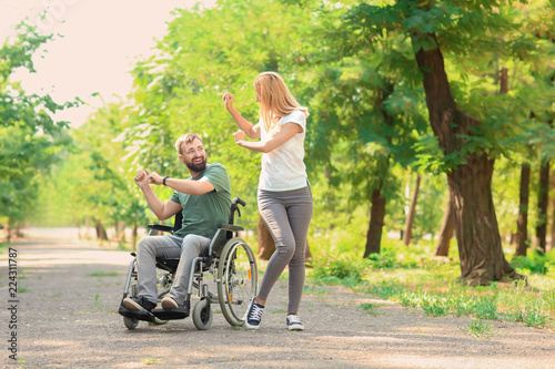 Man in wheelchair with beau...