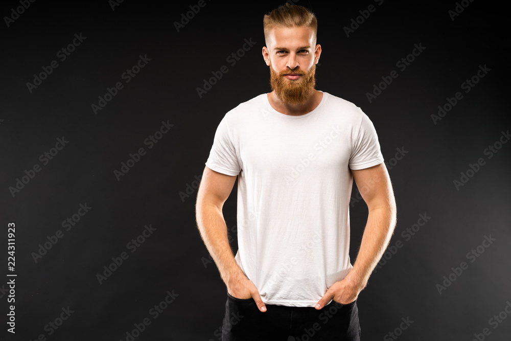 Handsome young guy posing in studio - isolated. Handsome young guy posing in studio - isolated.