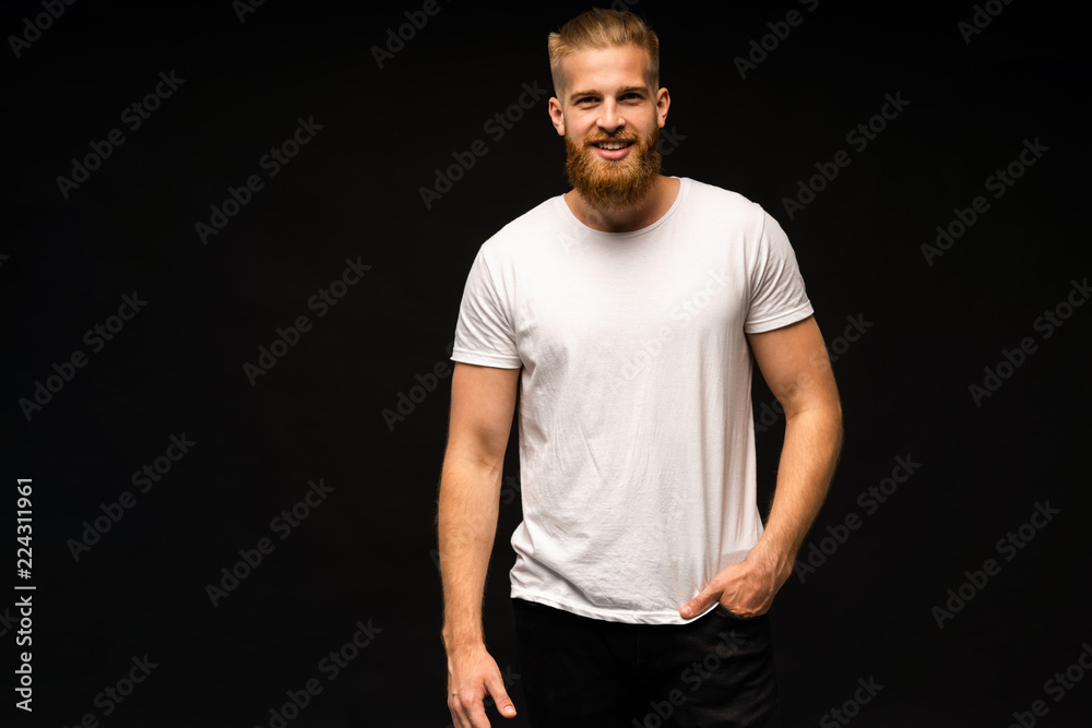 Handsome young guy posing in studio - isolated.