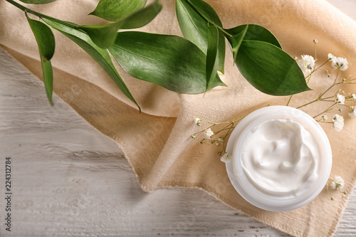 Wallpaper Mural Jar with body cream on white wooden table, top view Torontodigital.ca