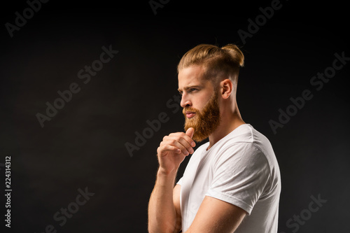 Bilde på lerret Side view portrait of thinking stylish young man looking away.