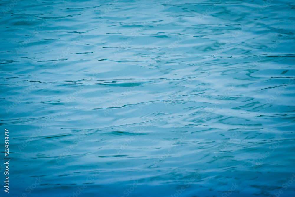blue water surface background texture blurred light with wave ripple nature abstract. blue water surface background texture blurred light with wave ripple nature abstract.