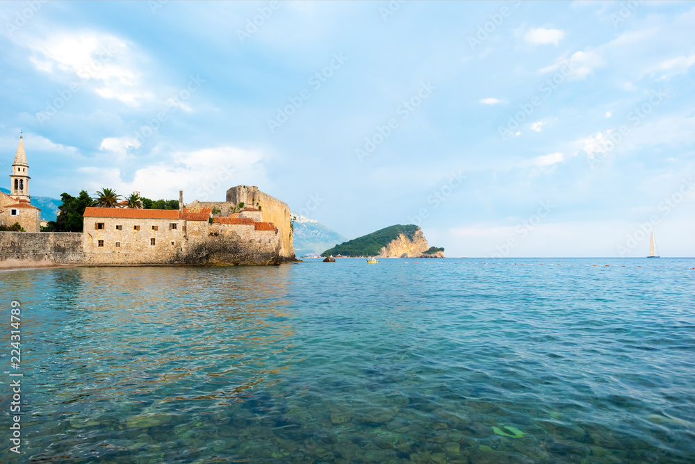 Bell Tower of Sveti Ivana Cathedral and Adriatic sea in Budva, Montenegro