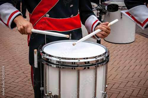 Details from a show and Marchingband or fanfare and drumband with uniforms and Instruments. photo