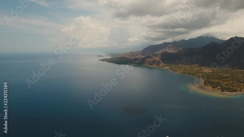 Coastline with beach, sea, mountains, sky. Tropical landscape, ocean, seashore BaliIndonesia 4K video Travel concept, aerial footage photo
