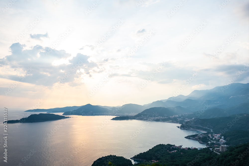 aerial view of Budva riviera and Adriatic sea during sunset in Montenegro