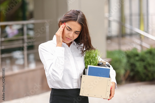 Fired stressed woman with p...