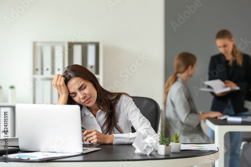Tired businesswoman working...