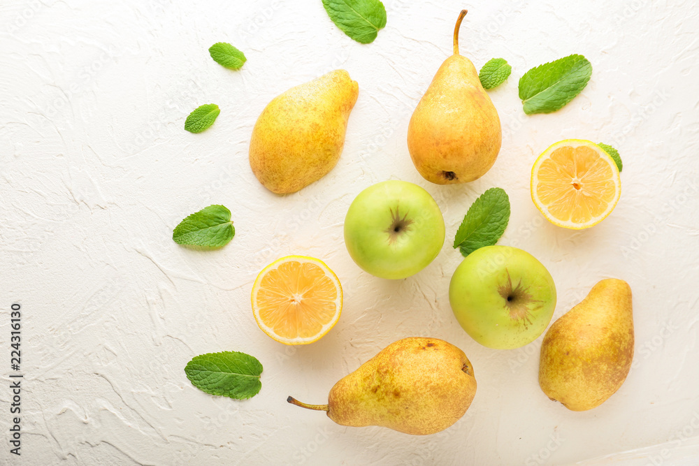 Summer composition with ripe fruits on white textured background Summer composition with ripe fruits on white textured background