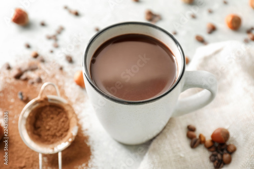 Fototapeta Naklejka Na Ścianę i Meble -  Cup of hot chocolate on light table