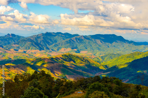 Beautiful  landscape view of hill and  mountain with cloud sky. © Pataradon