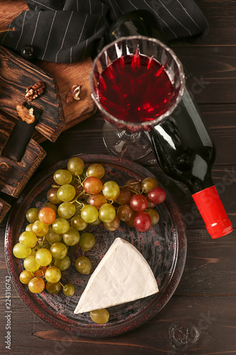 Red wine bottle and glass w...