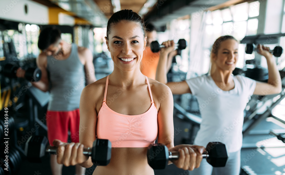 Group of people have workout in gym