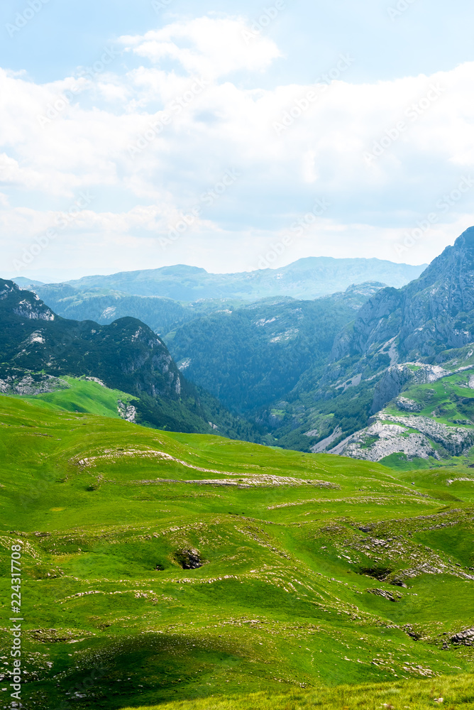 landscape of green valley and mountains in Durmitor massif, Montenegro
