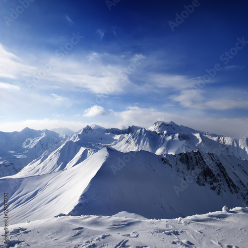 Snowy mountains and sunlight sky © BSANI