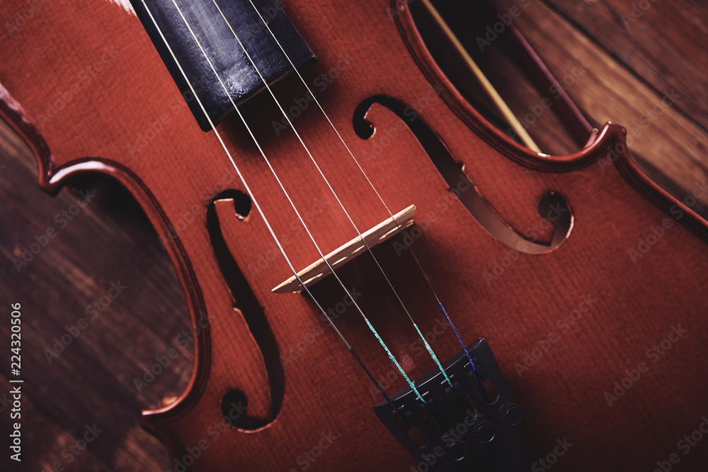 violin on an old wooden background violin on an old wooden background