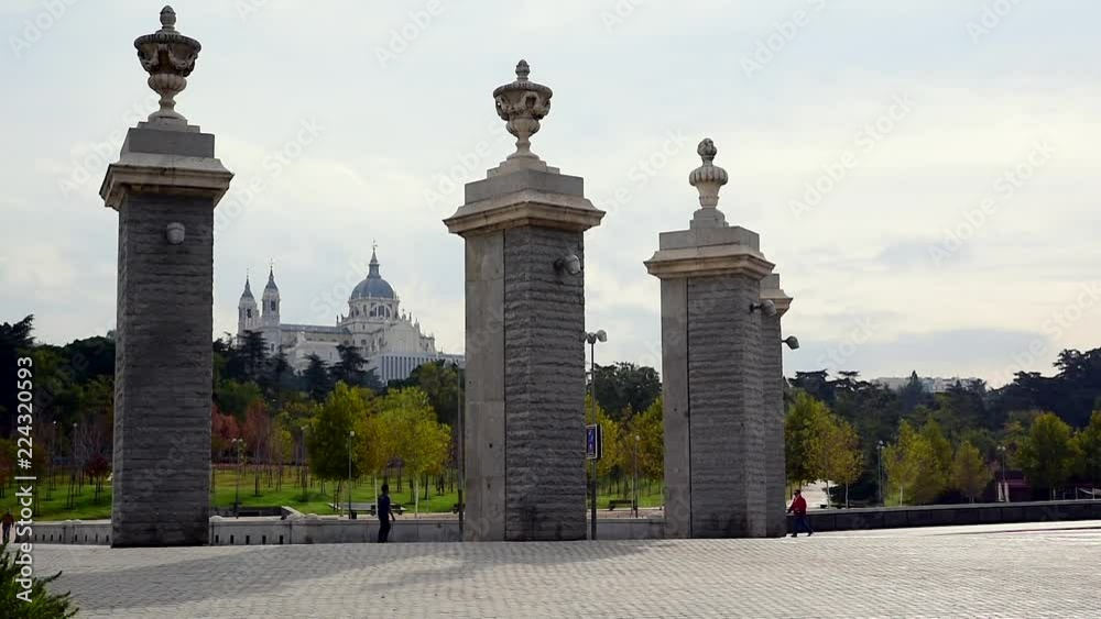 Bike lane and pedestrian promenade in Madrid Rio with la Mudena cathedral in the background Bike lane and pedestrian promenade in Madrid Rio with la Mudena cathedral in the background