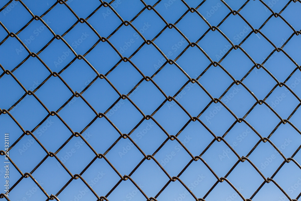 Metal fence from the grid. Protective fence. Texture