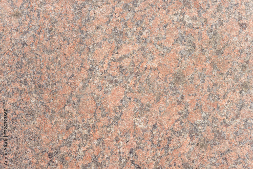 The texture of the stone. Granite. Pavement. Close-up The texture of the stone. Granite. Pavement. Close-up
