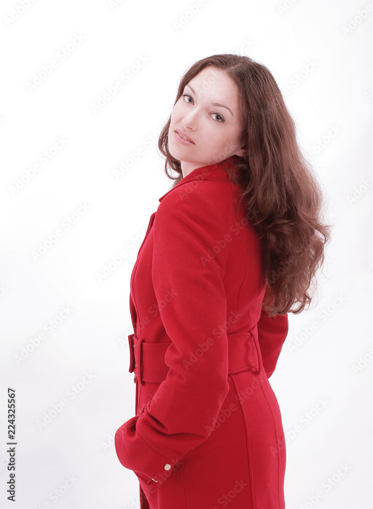 beautiful young woman in a red coat .isolated on white