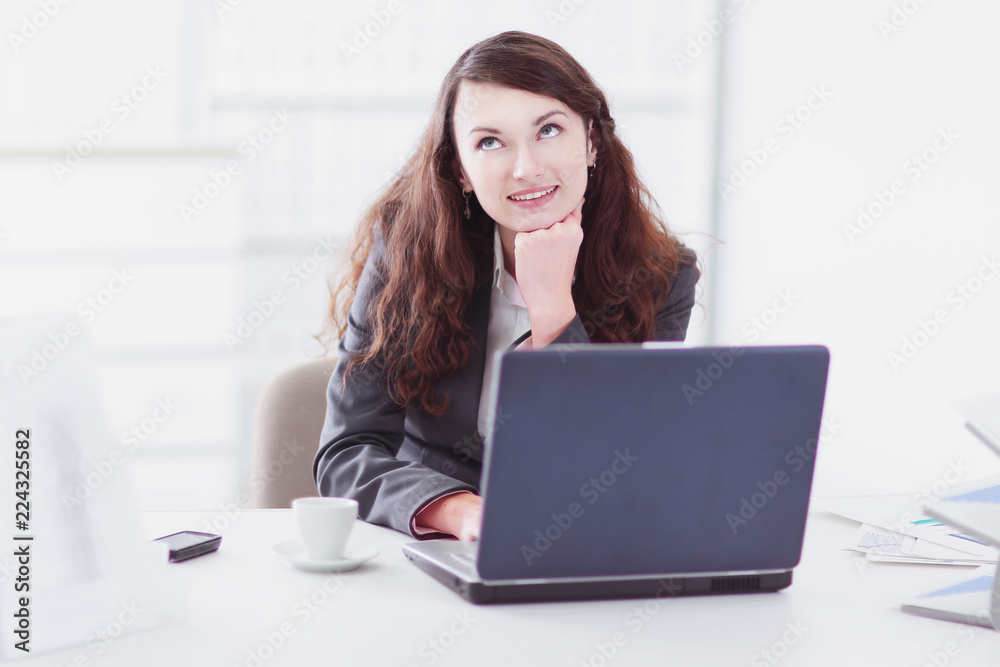 dreaming business woman sitting behind a Desk dreaming business woman sitting behind a Desk