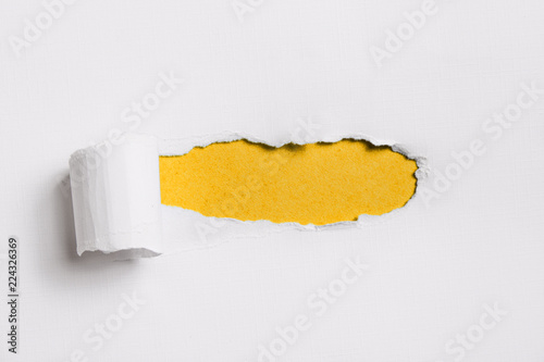 Torn white paper with yellow blank space for your text.
