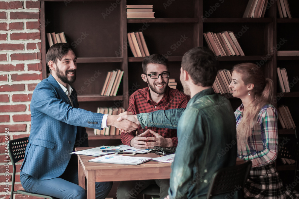 business partners shake hands after discussing the contract business partners shake hands after discussing the contract
