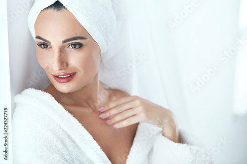 Spa Skin Care. Beautiful Woman In Towel At Spa Beauty Salon 