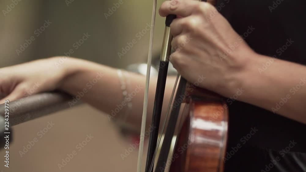 Close up view of violinist hands with violin. Close up view of violinist hands with violin.