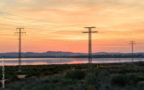 High voltage power lines at sunset © José Juan Noguerón