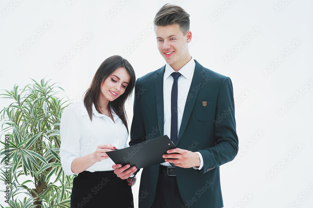 business colleagues discussing document standing business in the office. business colleagues discussing document standing business in the office.