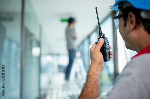 Worker using walkie talkie
