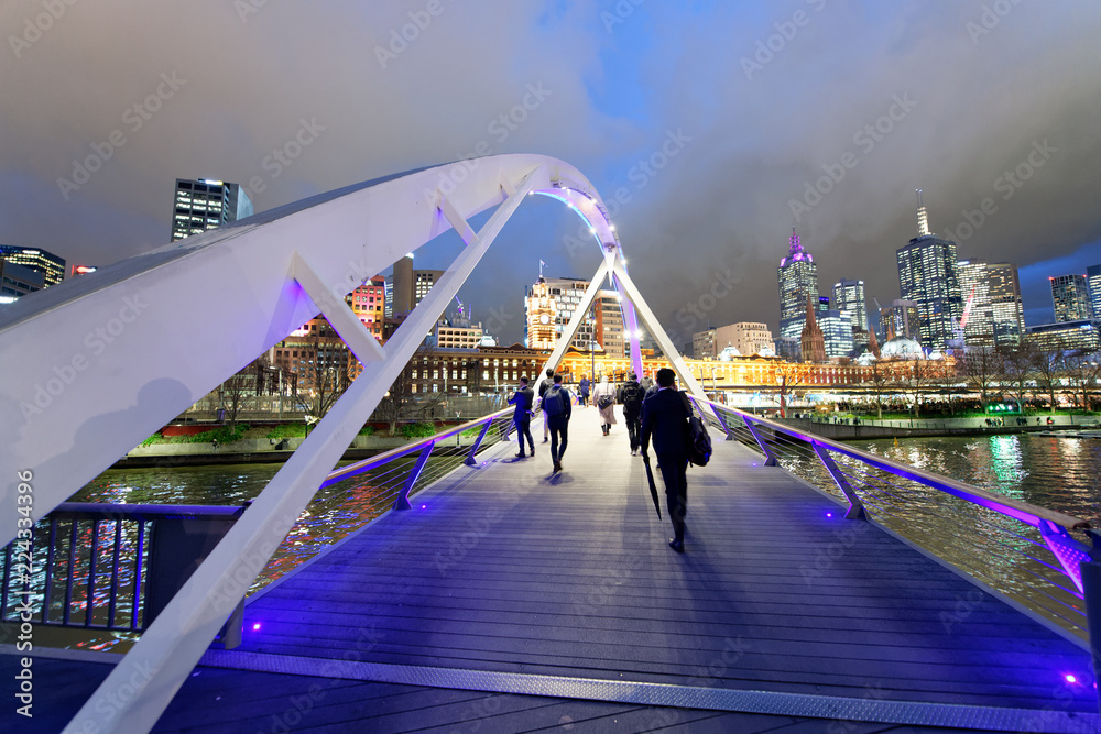 Naklejka premium City skyscrapers and Yarra river at night from Southbank Footbridge, Melbourne
